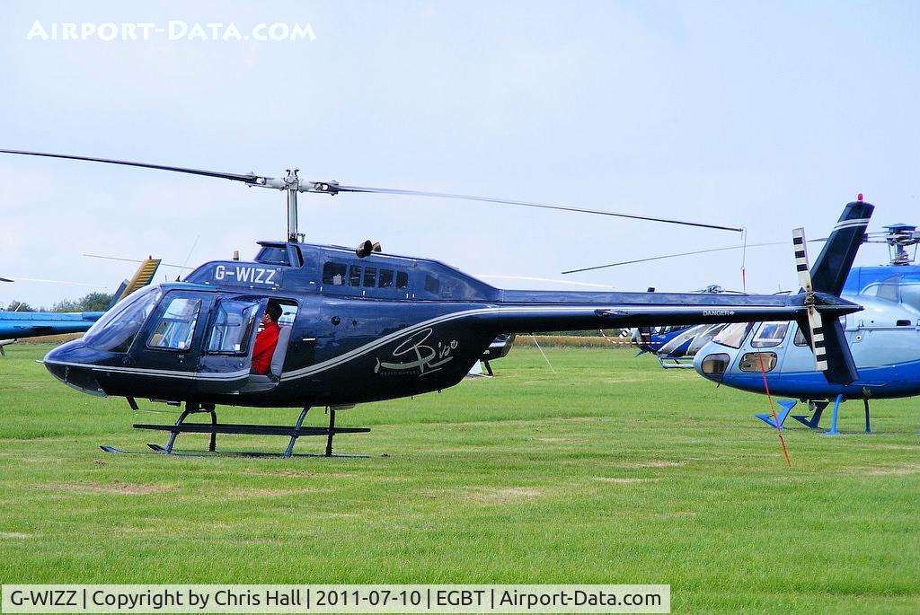 G-WIZZ, 1977 Agusta AB-206B JetRanger II C/N 8540, being used for ferrying race fans to the British F1 Grand Prix at Silverstone