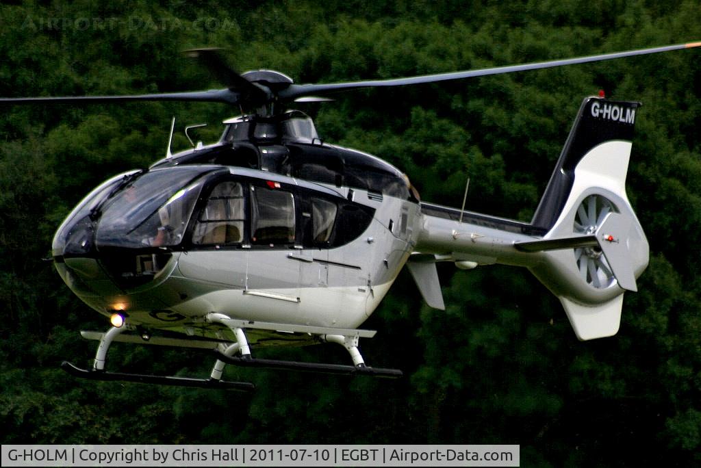 G-HOLM, 2007 Eurocopter EC-135T-2+ C/N 0574, being used for ferrying race fans to the British F1 Grand Prix at Silverstone