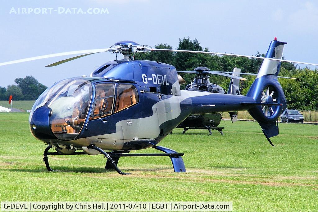 G-DEVL, 2001 Eurocopter EC-120B Colibri C/N 1273, being used for ferrying race fans to the British F1 Grand Prix at Silverstone