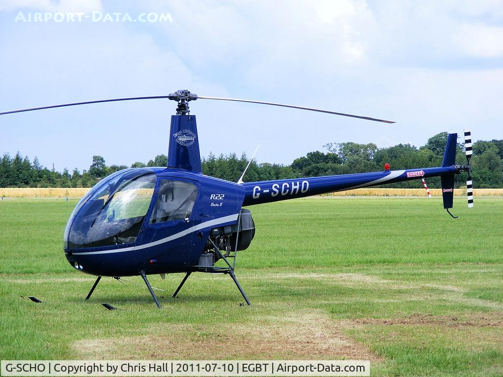 G-SCHO, 2005 Robinson R22 Beta II C/N 3833, being used for ferrying race fans to the British F1 Grand Prix at Silverstone