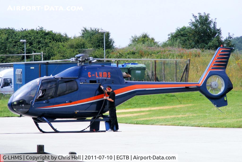 G-LHMS, 2006 Eurocopter EC-120B Colibri C/N 1442, being used for ferrying race fans to the British F1 Grand Prix at Silverstone