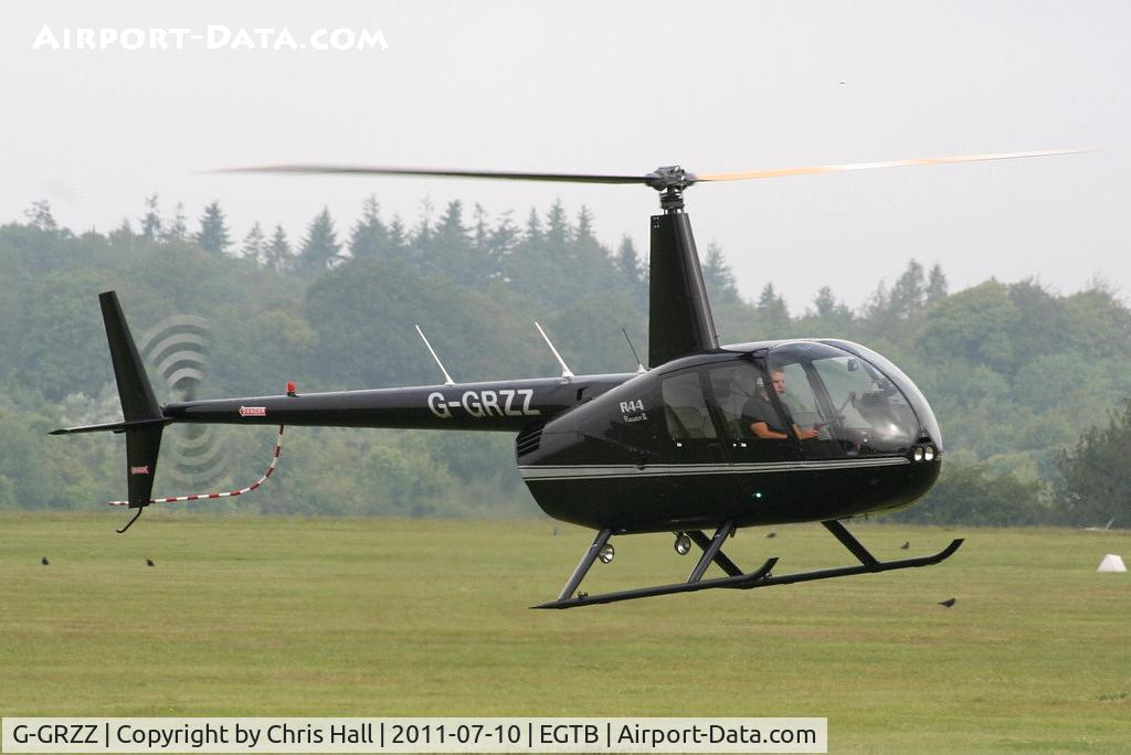 G-GRZZ, 2008 Robinson R44 Raven II C/N 12149, being used for ferrying race fans to the British F1 Grand Prix at Silverstone