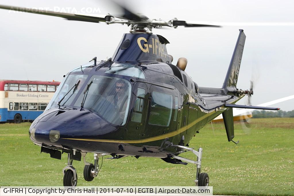 G-IFRH, 1990 Agusta A-109C C/N 7619, being used for ferrying race fans to the British F1 Grand Prix at Silverstone