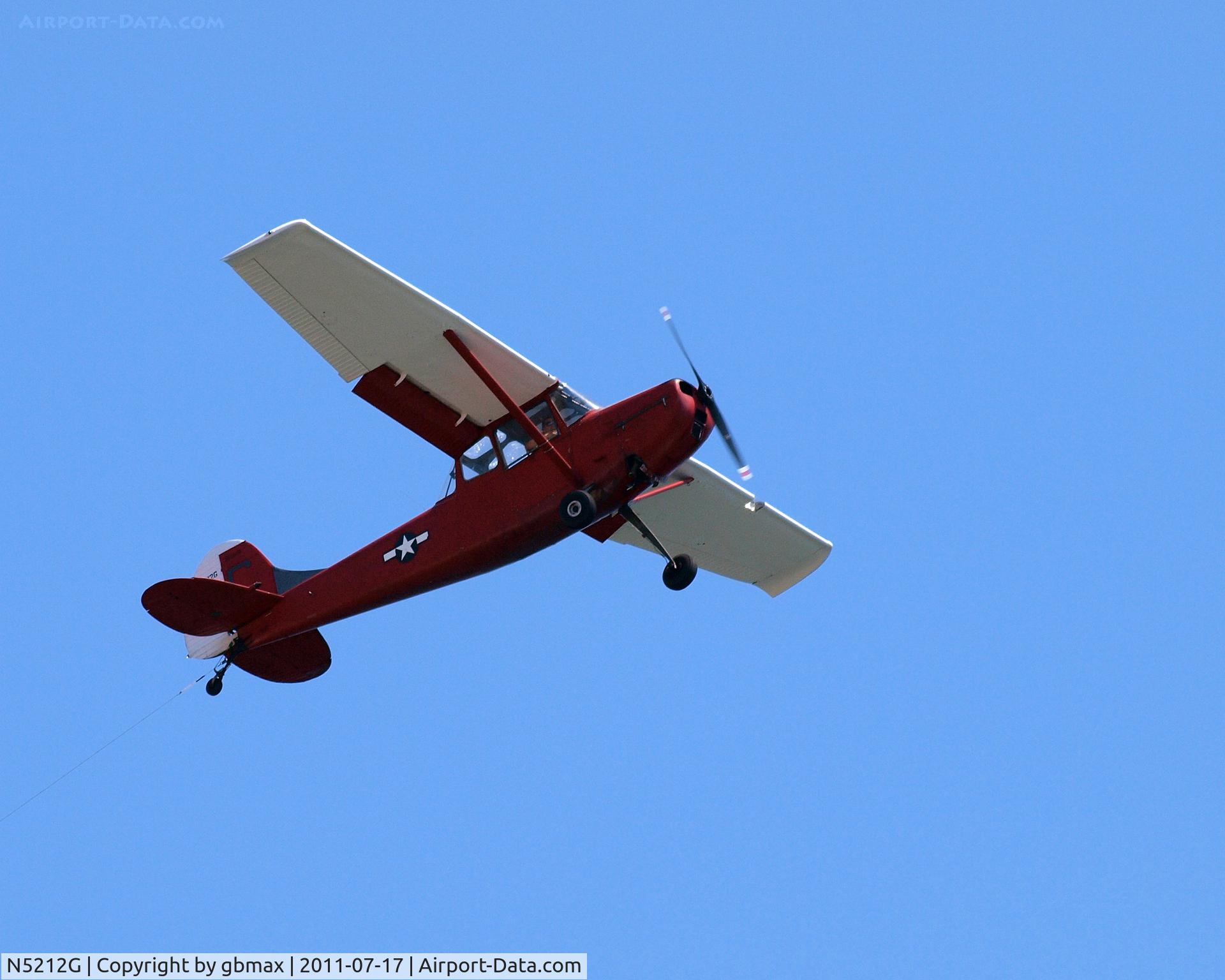 N5212G, 1950 Cessna 305A C/N 21201, Flying along Brighton Beach...