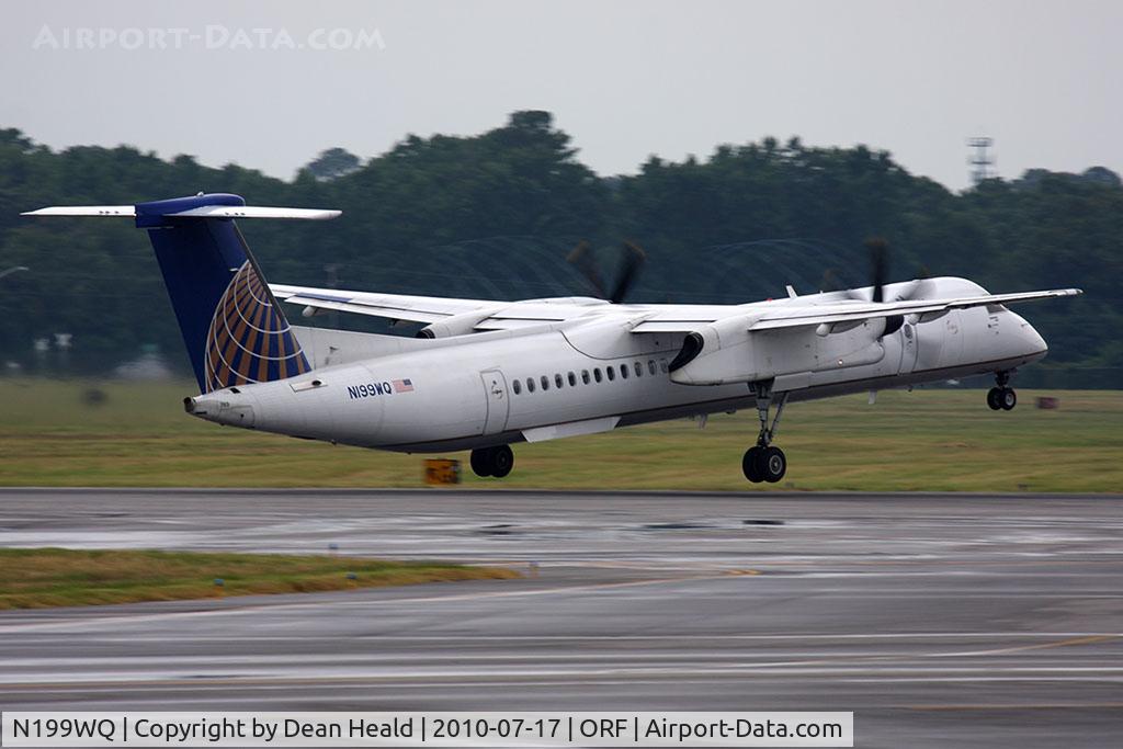 N199WQ, 2008 Bombardier DHC-8-402 Dash 8 C/N 4199, Continental Connection (Colgan Air) N199WQ departing RWY 23 en route to Newark Int'l (KEWR) in rainy conditions with condensation seen corkscrewing from the propeller tips.