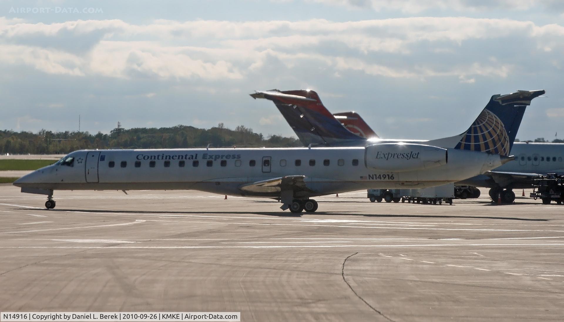 N14916, 2001 Embraer ERJ-145LR (EMB-145LR) C/N 145415, Seen taxying past two DC-9s, both of which would eventually wear Delta's new colors.
