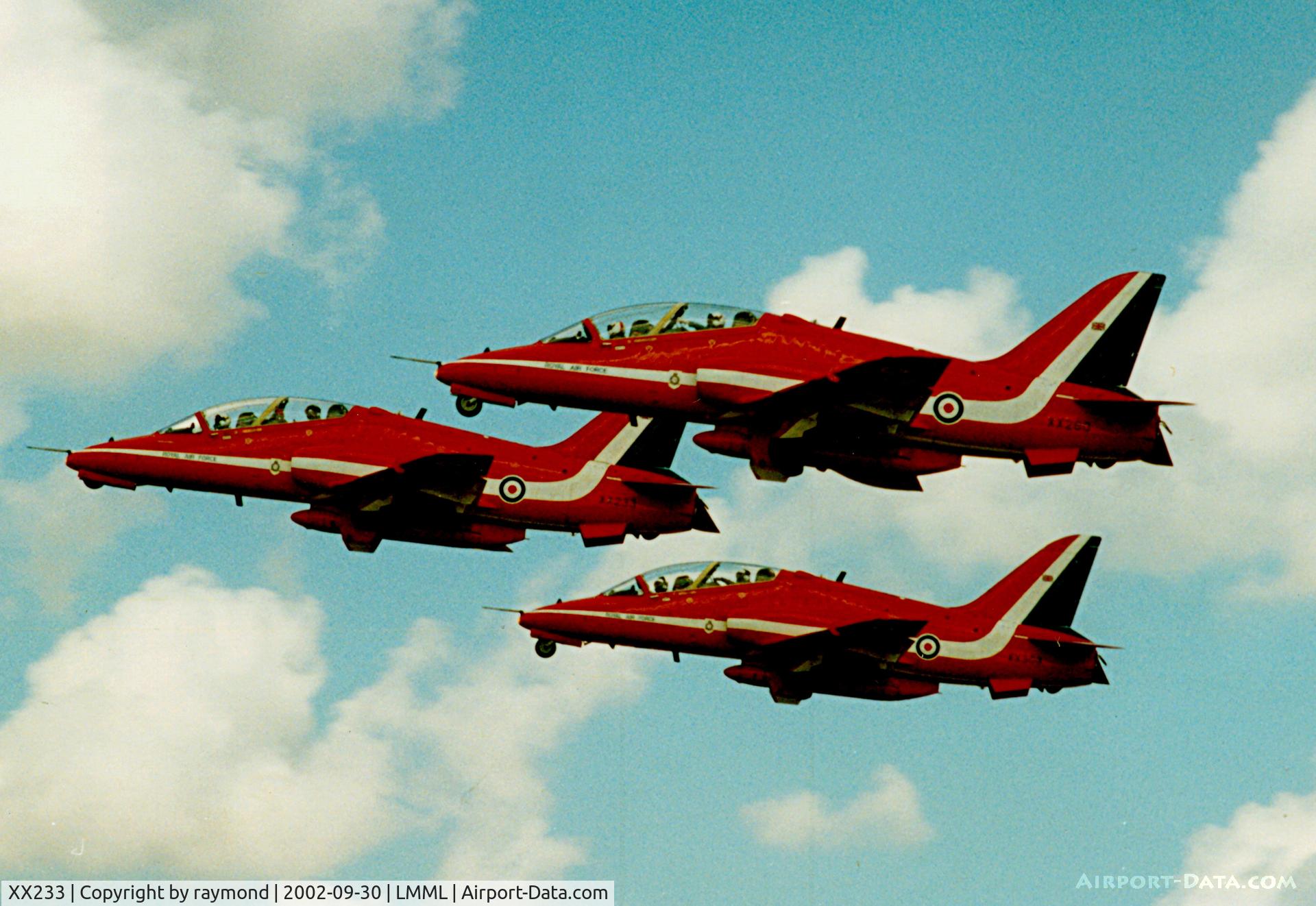 XX233, 1978 Hawker Siddeley Hawk T.1 C/N 069/312069, Hawk T1 XX233 leading a trio departure after a superb display of the Red Arrows after participating in the Malta International Airshow 2002.