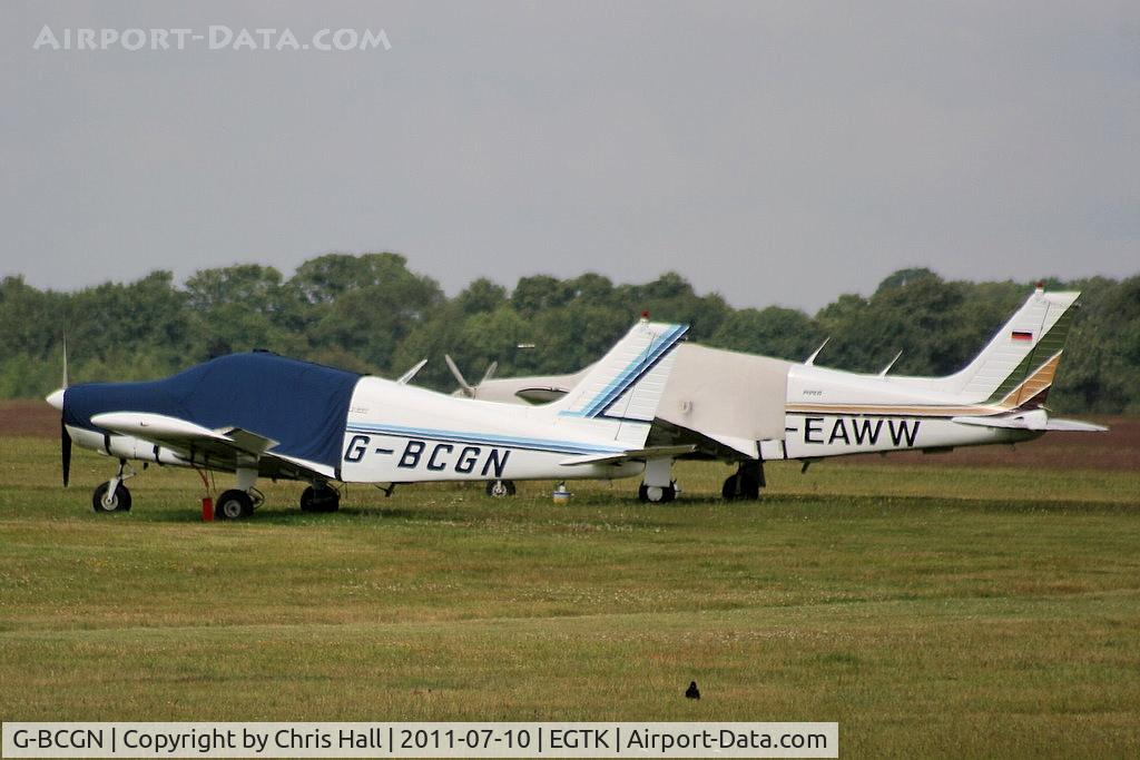 G-BCGN, 1974 Piper PA-28-140 Cherokee Cruiser C/N 28-7425323, parked alongside D-EAWW