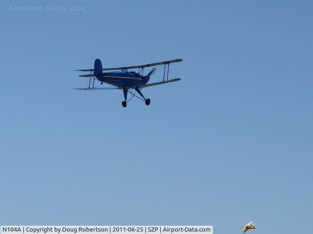 N104A, 1947 Aero C.104S Jungmann C/N 212, 1947 Bucker BU1.131 JUNGMANN, Lycoming O&VO-360 180 Hp upgrade conversion, takeoff climb Rwy 22-N100BU JUNGMEISTER at lower right