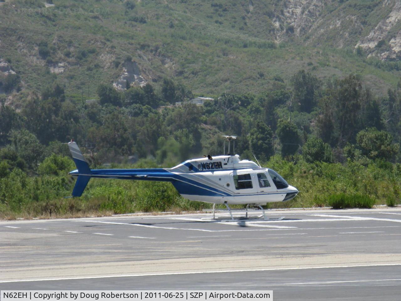 N62EH, 1991 Bell 206B JetRanger II C/N 4191, 1991 Bell 206B JET RANGER II, one Allison 250-C20 Turboshaft 400 shp turning and burning on SZP Helipad. Note exhaust heat wave blur of background foliage