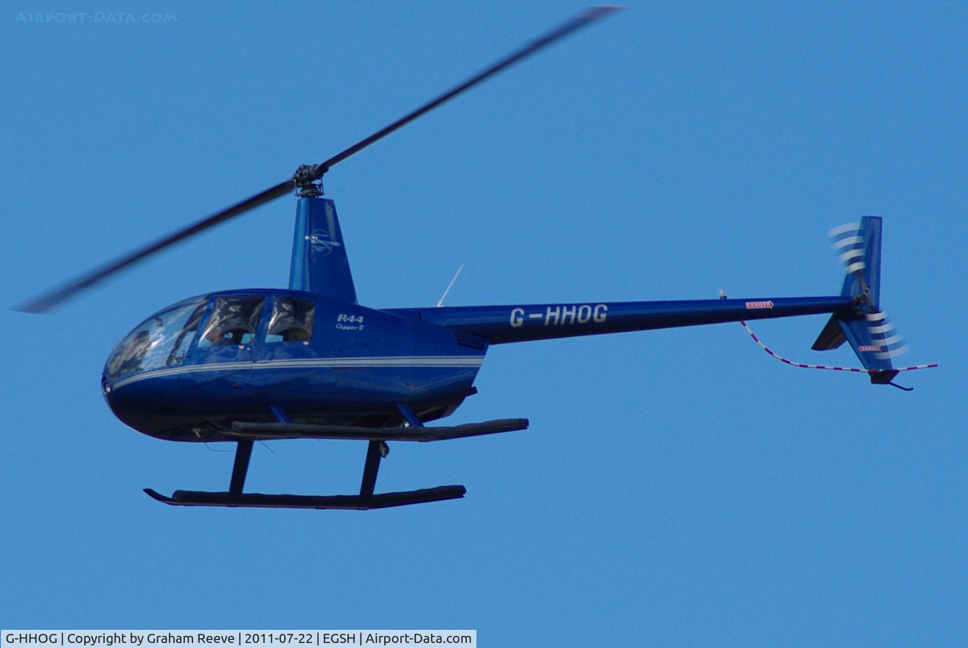 G-HHOG, 2004 Robinson R44 Clipper II C/N 10584, About to land.