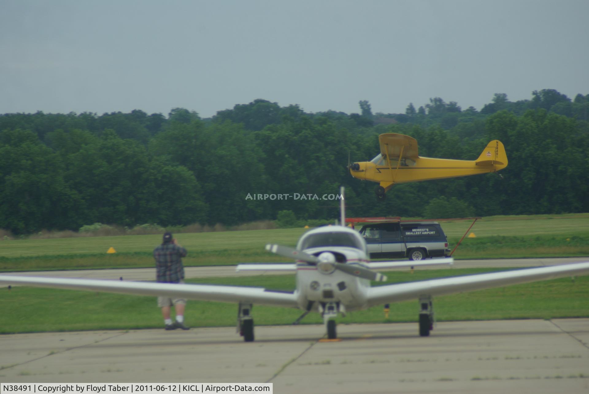 N38491, Piper J3C-65 Cub Cub C/N 7064, Just before touchdown at the Midwest smallest airport with Harry Barr at the controls