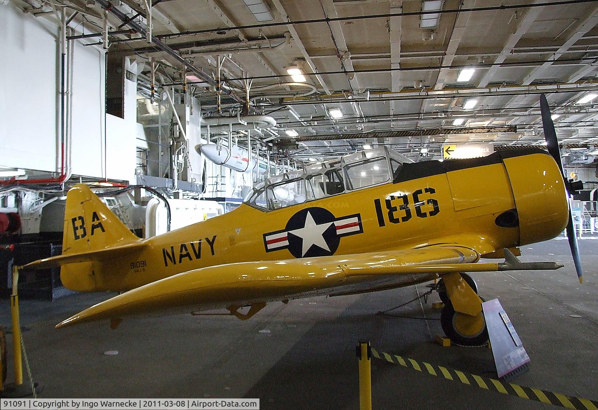 91091, North American SNJ-5 Texan Texan C/N 121-42107, North American SNJ-5 Texan in the Hangar of the USS Midway Museum, San Diego CA