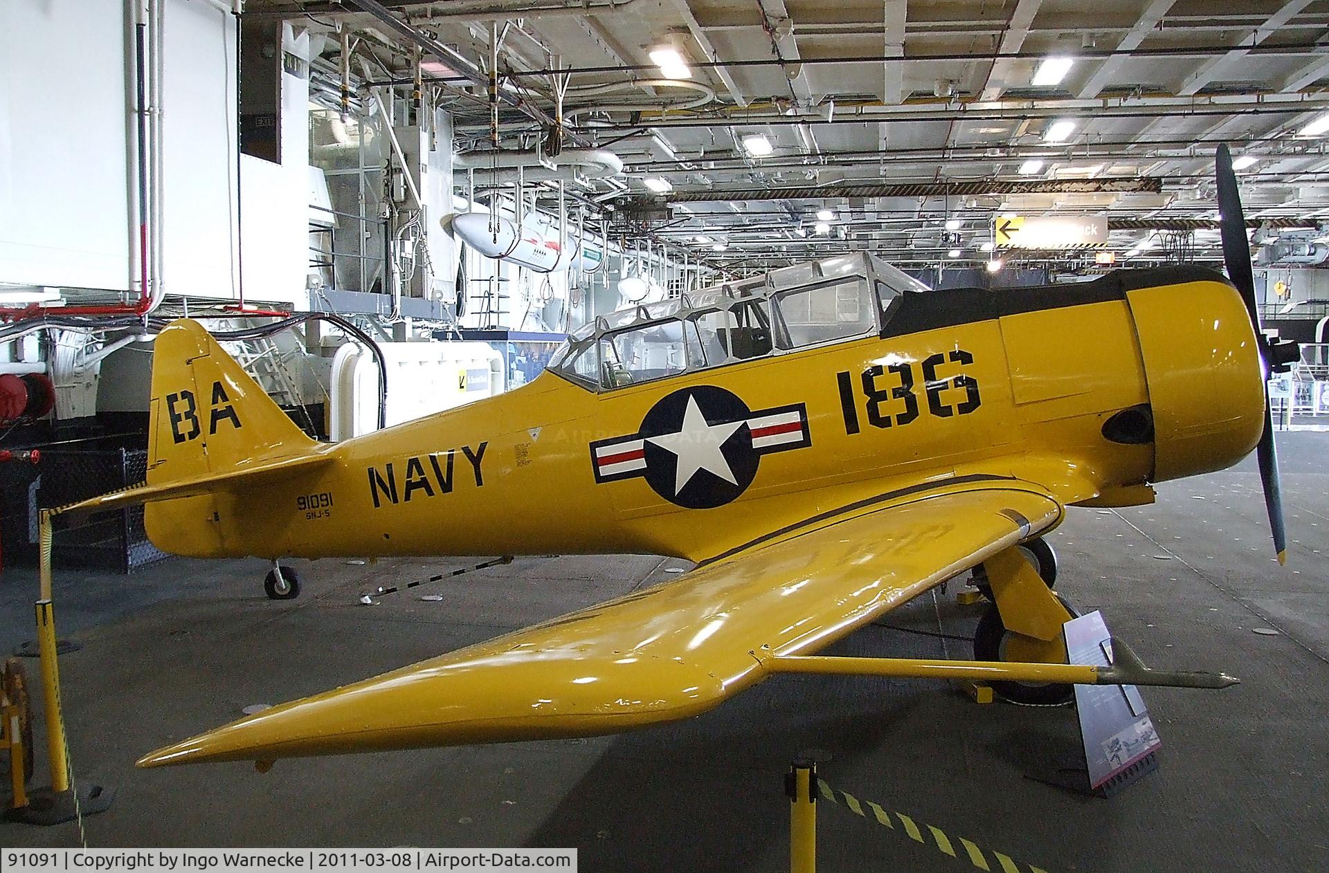 91091, North American SNJ-5 Texan Texan C/N 121-42107, North American SNJ-5 Texan in the Hangar of the USS Midway Museum, San Diego CA