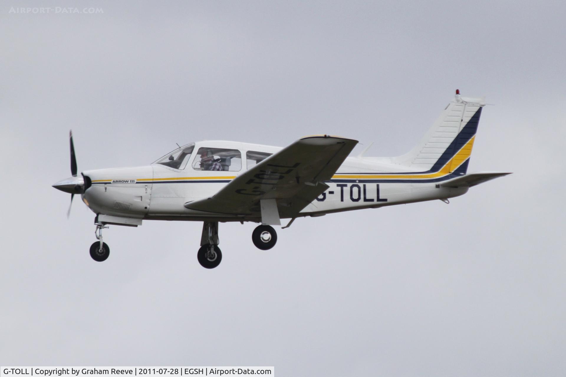 G-TOLL, 1977 Piper PA-28R-201 Cherokee Arrow III C/N 28R-7837025, About to touch down.