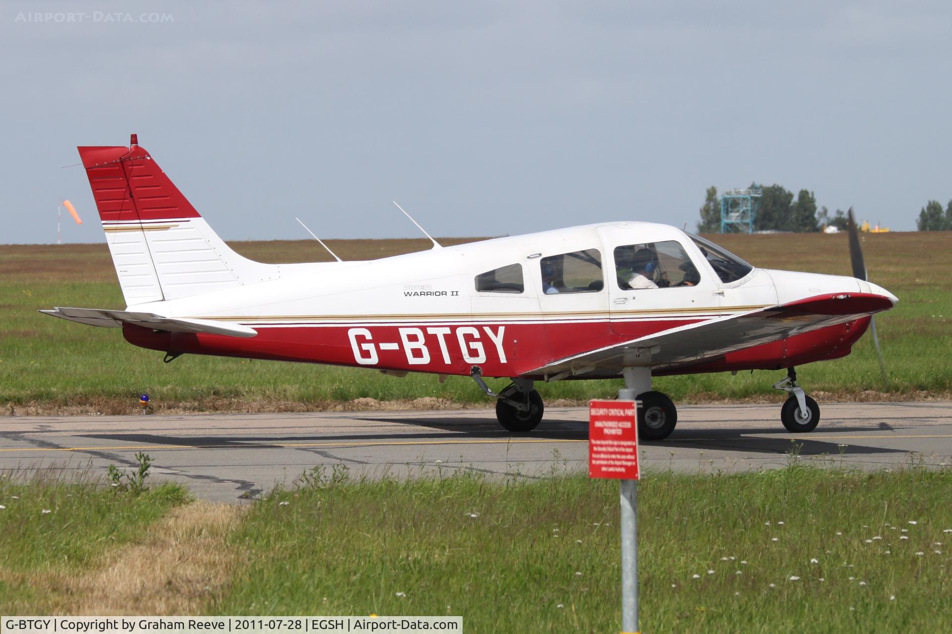 G-BTGY, 1982 Piper PA-28-161 Cherokee Warrior II C/N 28-8216199, Departing from Norwich.