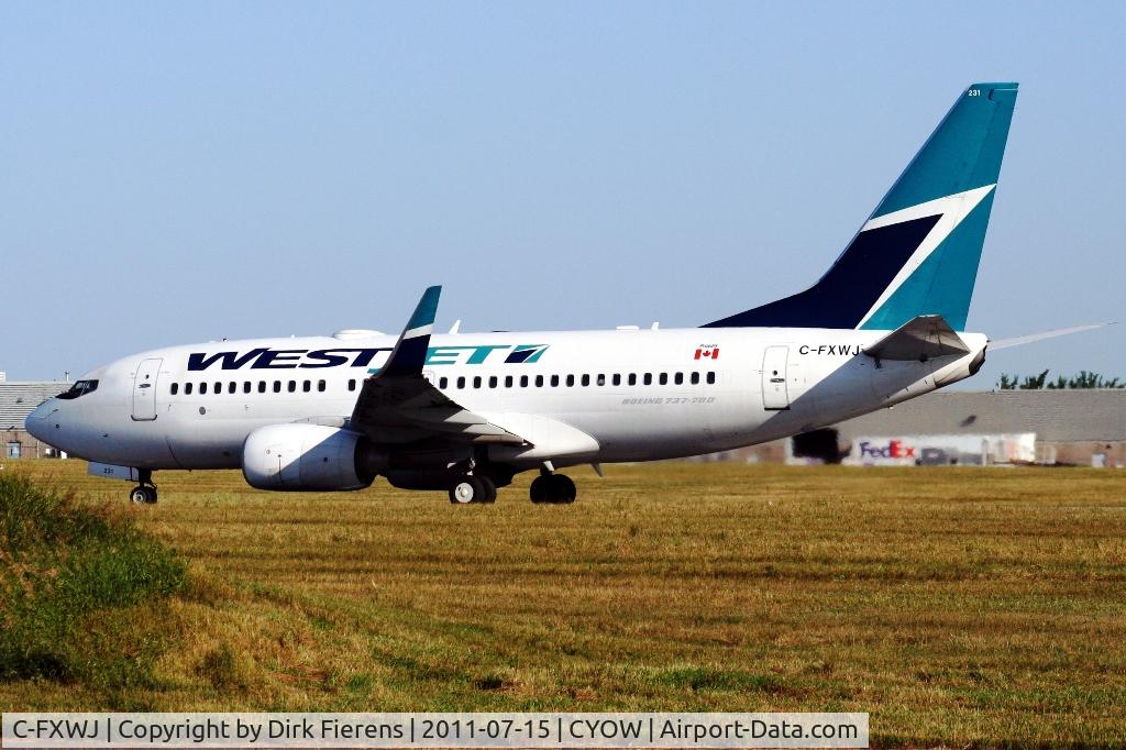 C-FXWJ, 2005 Boeing 737-7CT C/N 32768, Departing Ottawa down rwy 25.
