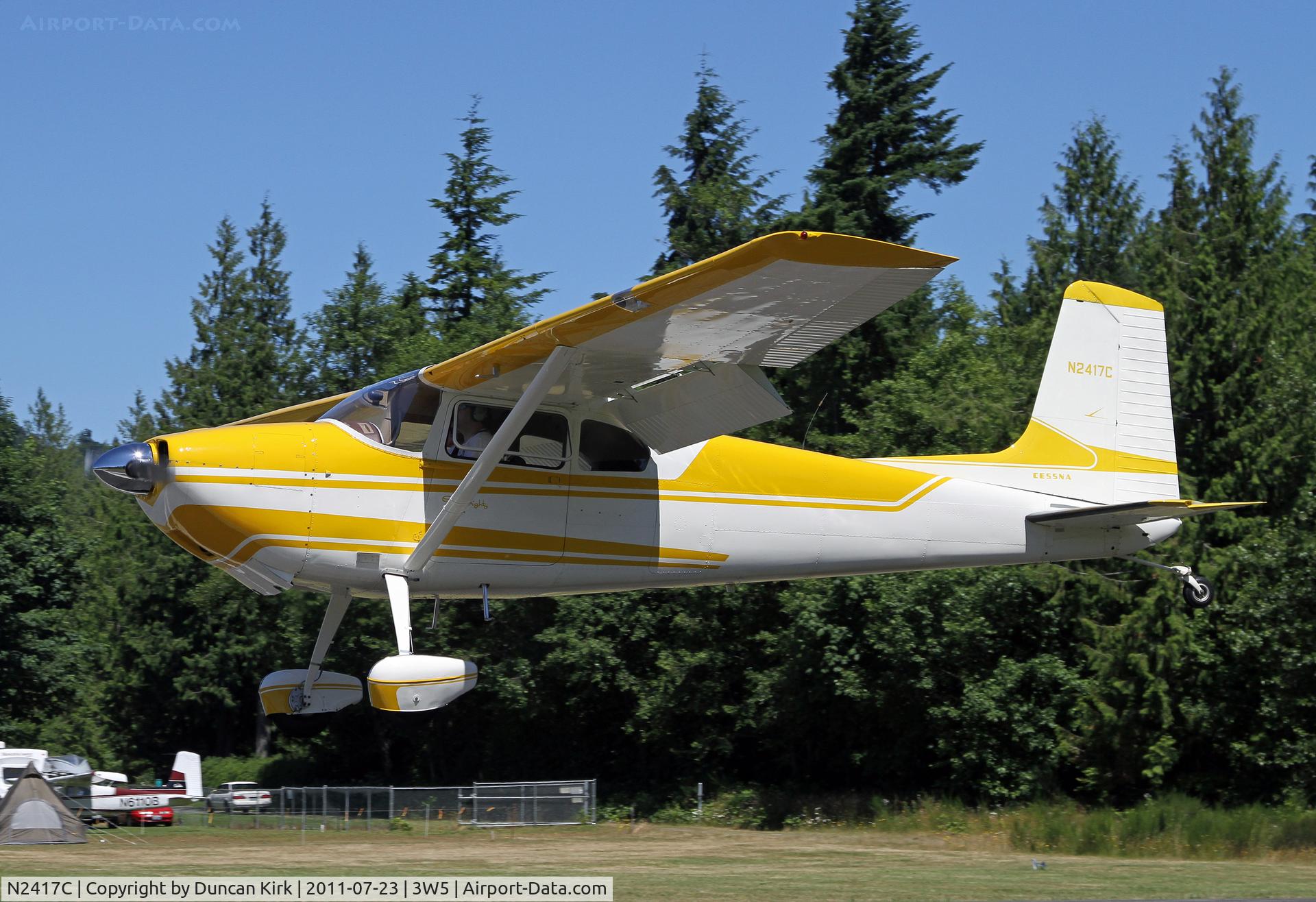 N2417C, 1954 Cessna 180 C/N 30717, Wearing spats this Cessna 180 is arriving for the fly-in