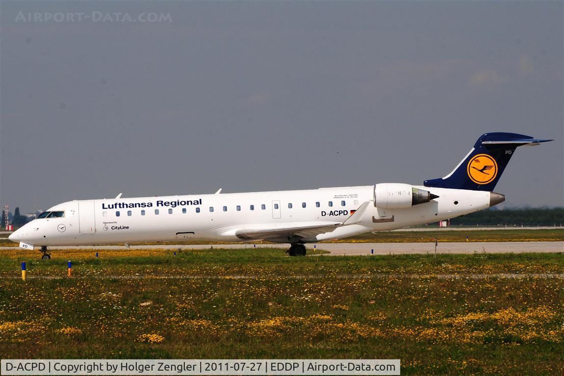 D-ACPD, 2001 Canadair CRJ-701ER (CL-600-2C10) Regional Jet C/N 10015, Noon shuttle from MUC is taxiing in beautiful sunlight.