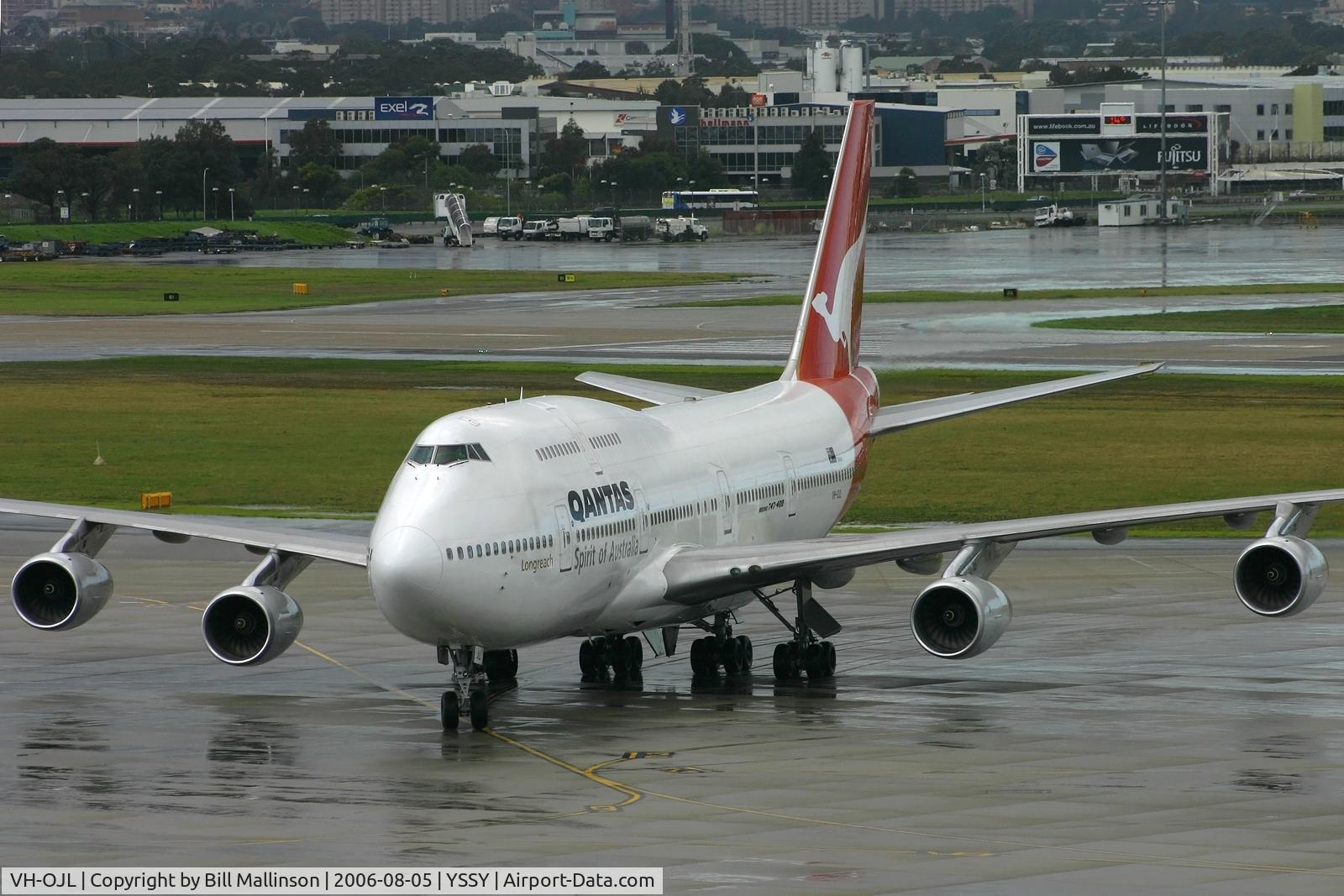 VH-OJL, 1991 Boeing 747-438 C/N 25151, arriving to a very wet SYD