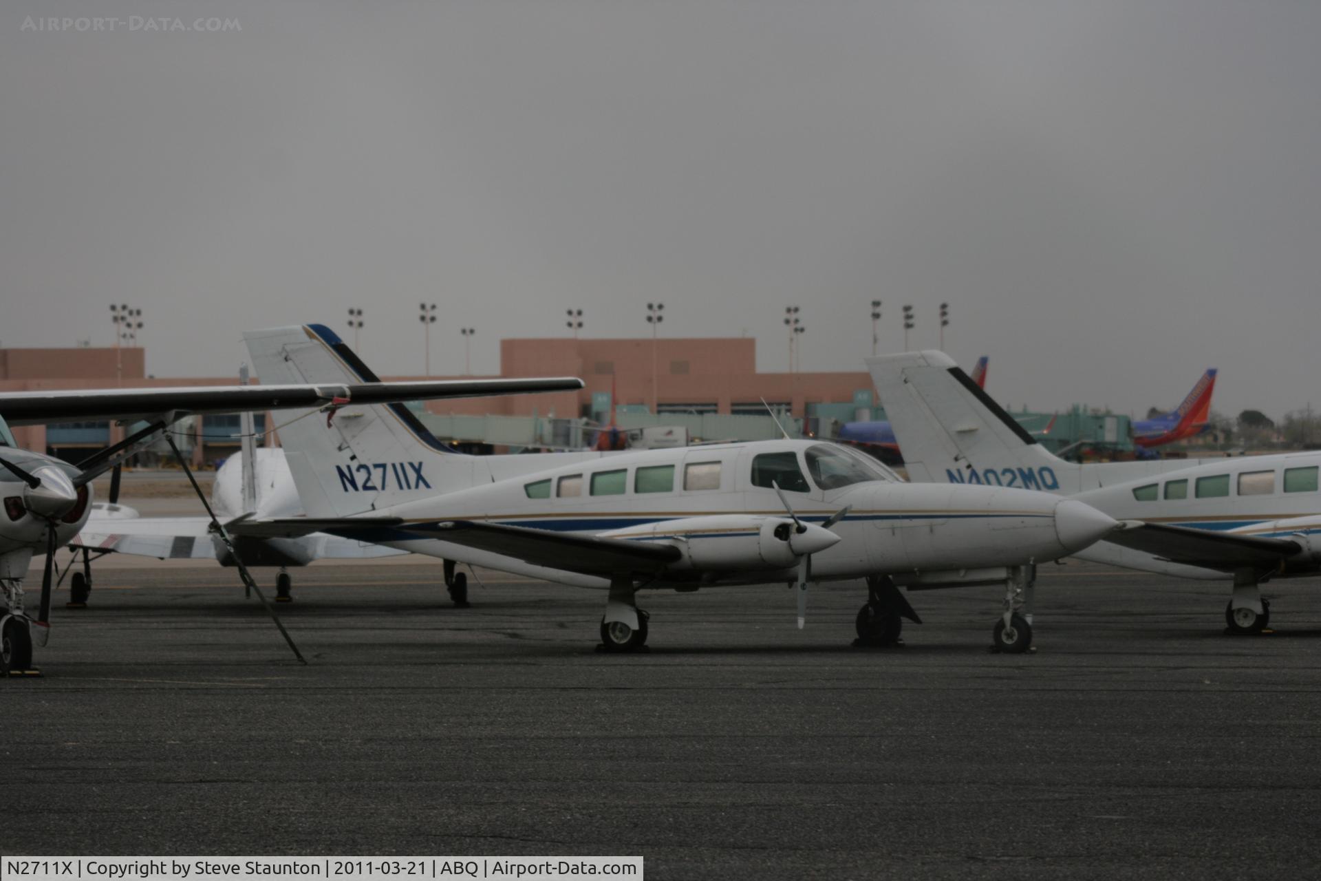 N2711X, 1979 Cessna 402C C/N 402C0116, Taken at Alburquerque International Sunport Airport, New Mexico in March 2011 whilst on an Aeroprint Aviation tour