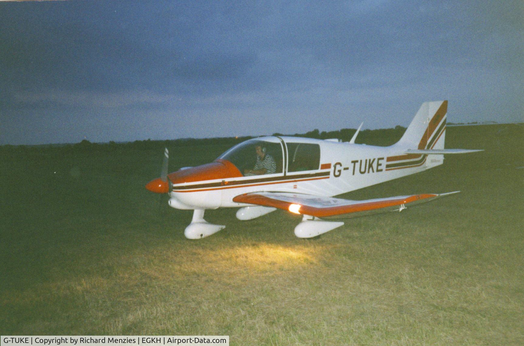 G-TUKE, 1981 Robin DR-400-160 Chevalier C/N 1542, Taxiing after landing at Headcorn, as dusk descends.