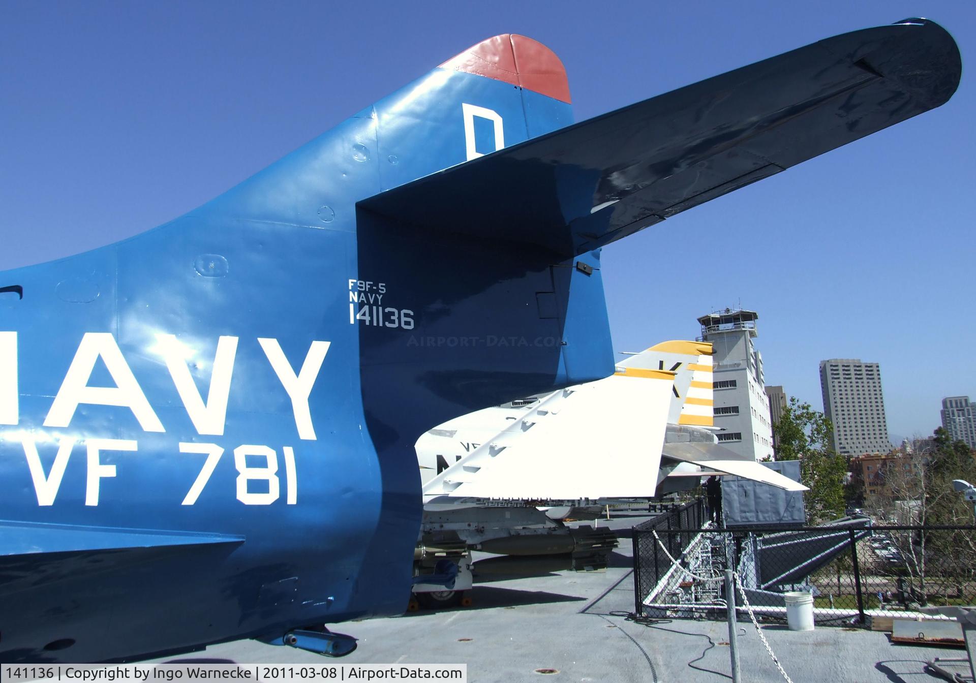141136, Grumman F9F-8 Cougar C/N Not found 141136, Grumman F9F-5 Panther on the flight deck of the USS Midway Museum, San Diego CA