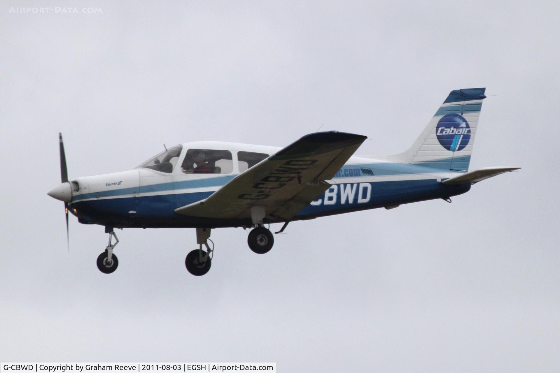 G-CBWD, 2002 Piper PA-28-161 Cherokee Warrior III C/N 2842160, About to land.