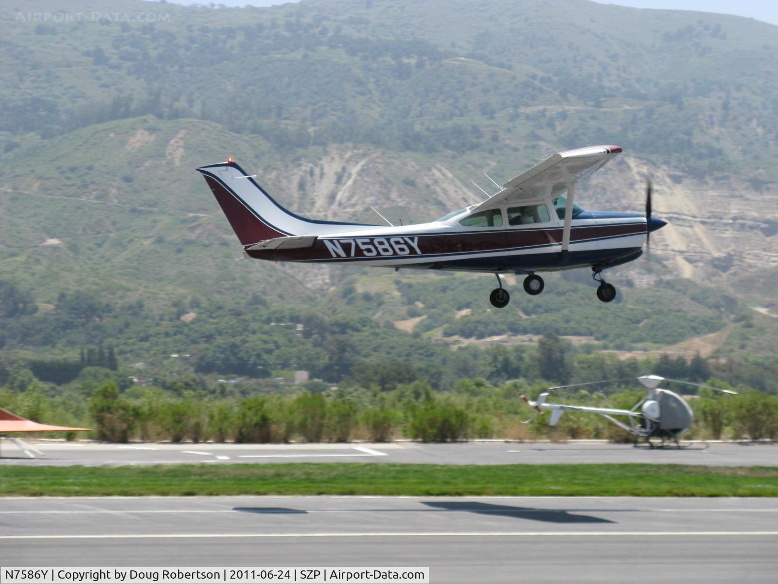 N7586Y, 1977 Cessna R182 Skylane RG C/N R18200140, 1977 Cessna R182 SKYLANE RG, Lycoming O-540-J3C5D 235 Hp, takeoff climb Rwy 22, sucken 'em up!