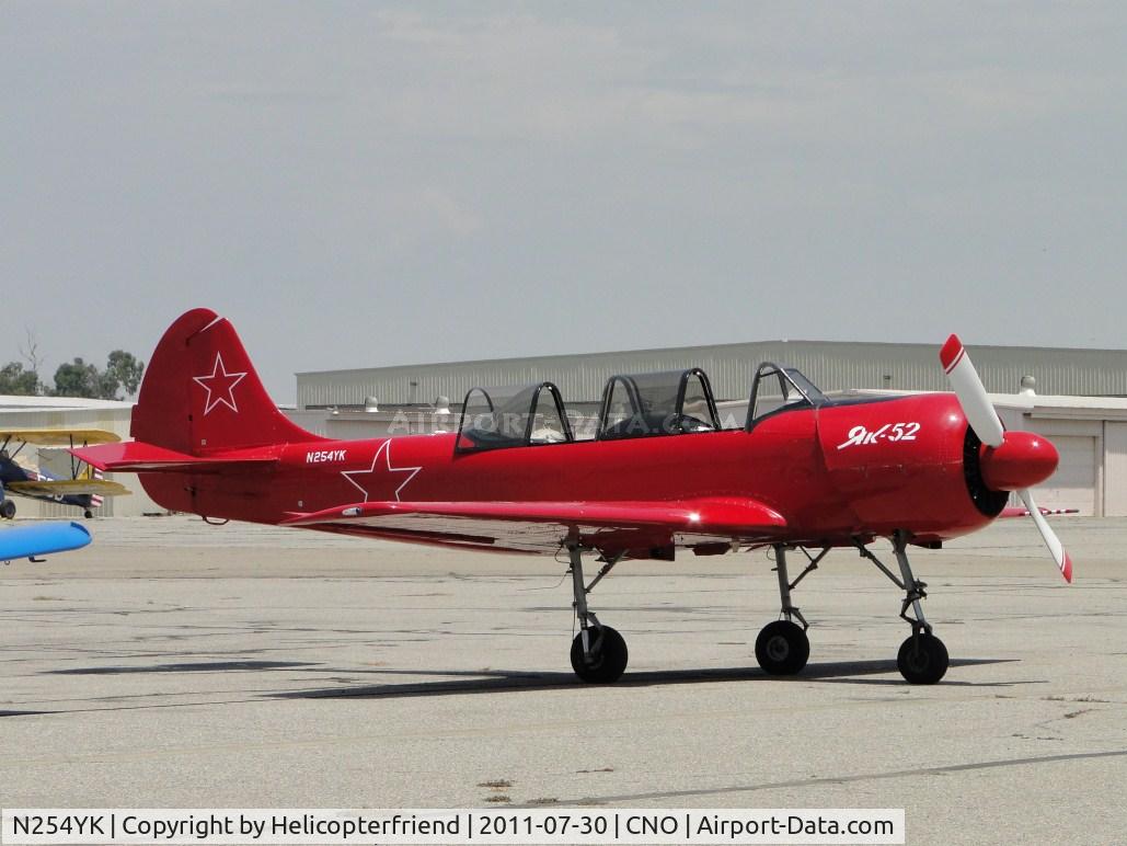 N254YK, 1985 Yakovlev Yak-52 C/N 855410, Parked in the center west parking area