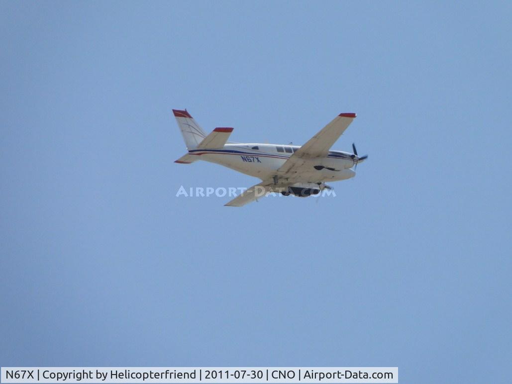 N67X, 1967 Beech 65-A90-1 C/N LM-14, Wheels retracted and heading westbound