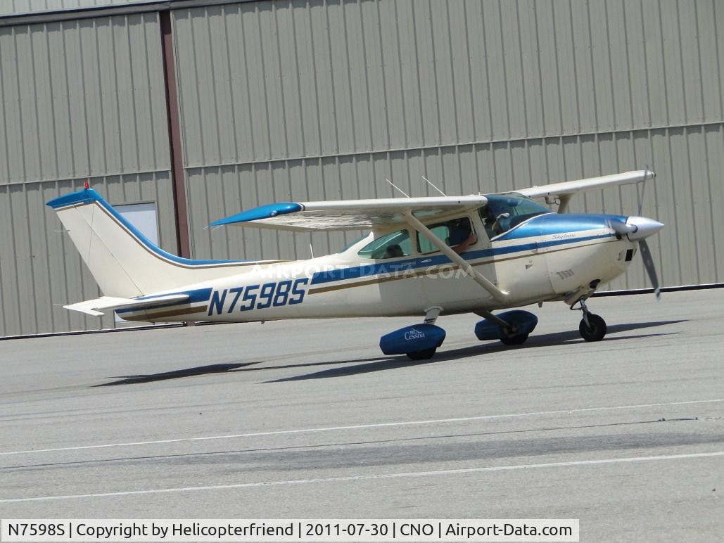 N7598S, 1976 Cessna 182Q Skylane C/N 18265247, Taxiing between the hangers enroute to runway area