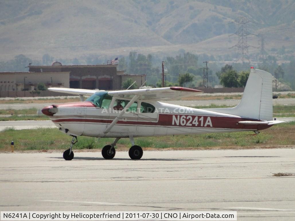 N6241A, 1956 Cessna 182 Skylane C/N 33041, Taxiing to runway, note tow cable from tail area, appears to be  hooked on pilot's window area