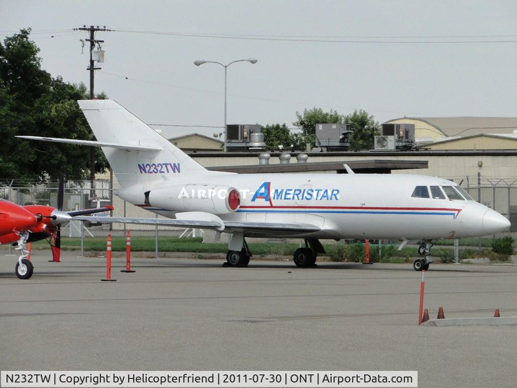 N232TW, 1966 Dassault Falcon 20C C/N 32, Engines covered and parked on the southside