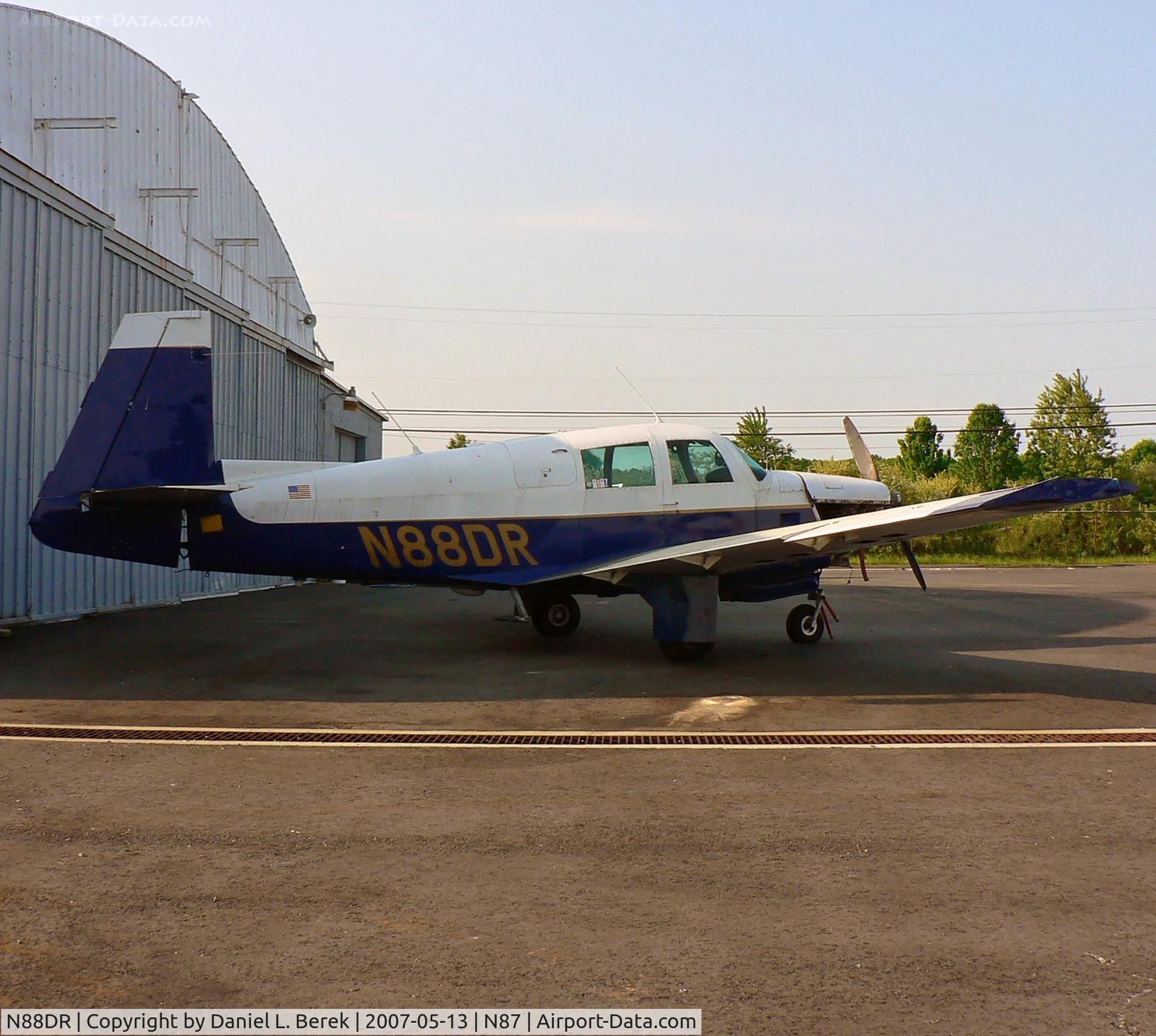 N88DR, 1965 Mooney M20C Ranger C/N 3170, Posing in front of the main hanger at Trenton Robbinsville Airport, a Mooney Ranger awaits maintenance.