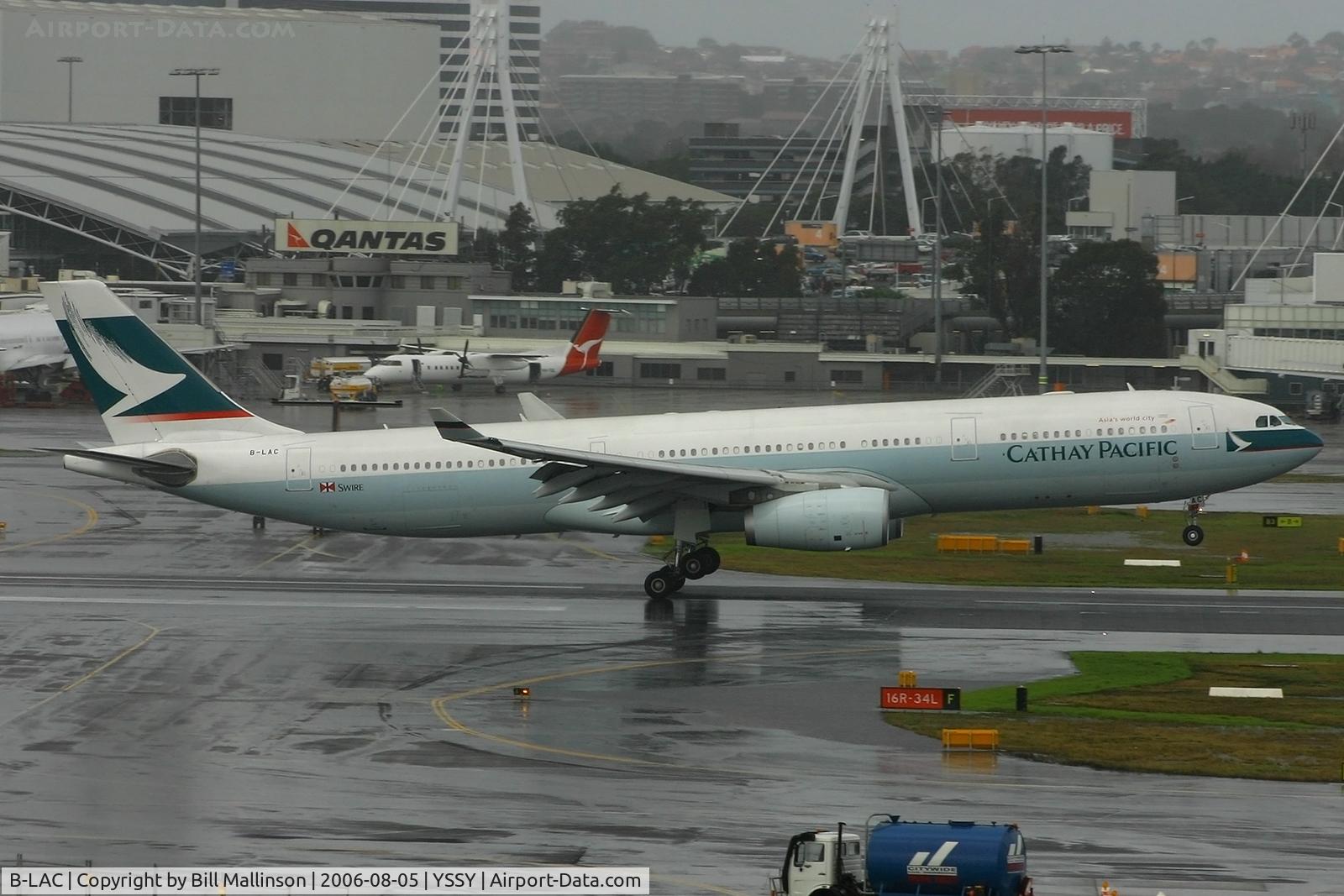 B-LAC, 2005 Airbus A330-343 C/N 679, down onto a very wet 16R