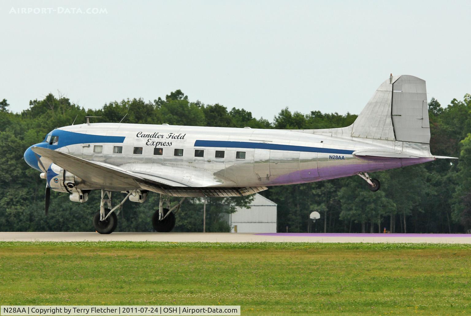 N28AA, 1940 Douglas DC-3A C/N 2239, The Candler Field Express - a 1940 Douglas DC3A, c/n: 2239 - lands on the purple marker at 2011 Oshkosh