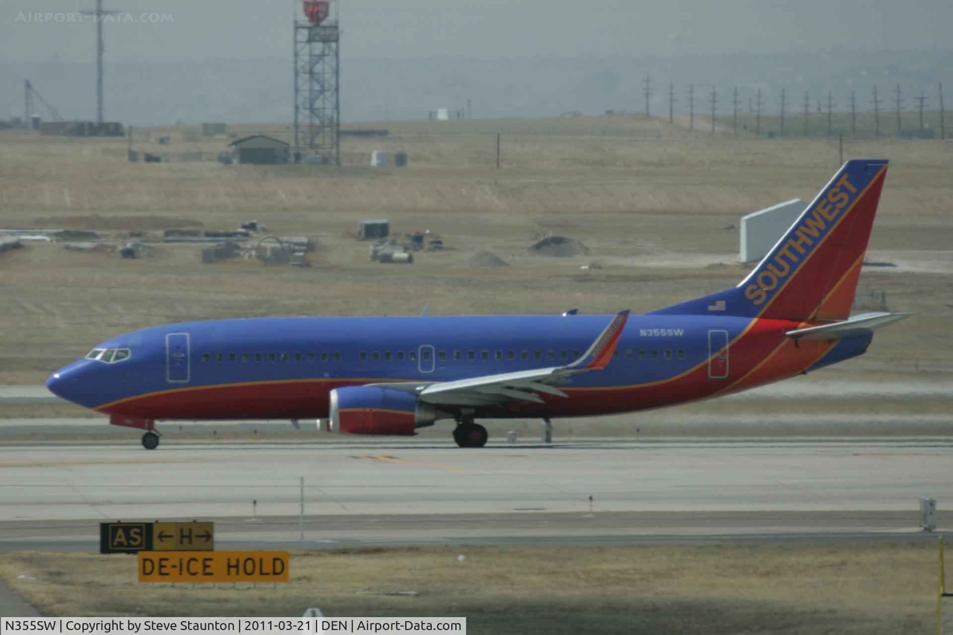 N355SW, 1991 Boeing 737-3H4 C/N 25250, Taken at Denver International Airport, in March 2011 whilst on an Aeroprint Aviation tour