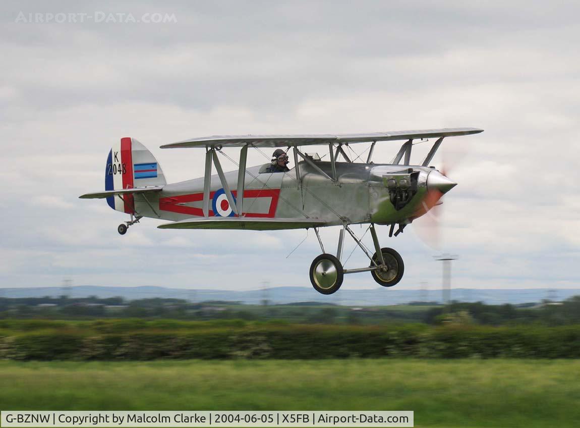 G-BZNW, 2003 Isaacs Fury II C/N PFA 011-13402, Isaacs Fury II on a low pass over Fishburn Airfield, June 2004.