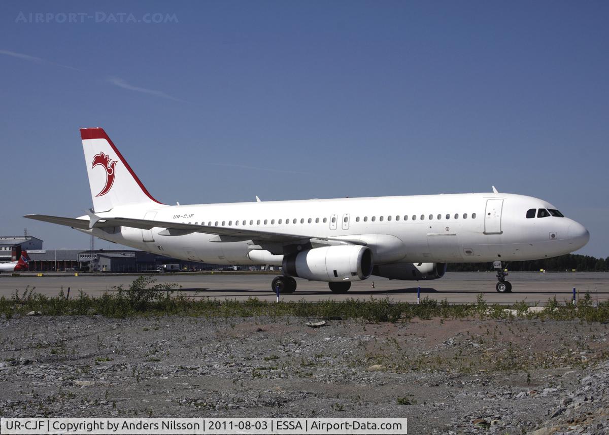 UR-CJF, 1993 Airbus A320-231 C/N 405, ATA Airlines logo on tail. Parked at stand 69.
