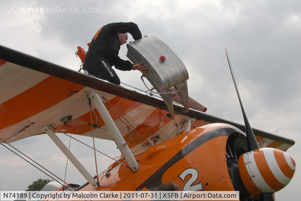 N74189, 1941 Boeing PT-17/R985 Kaydet (A75N1) C/N 75-717, Pilot David Barrell re-assembles the 