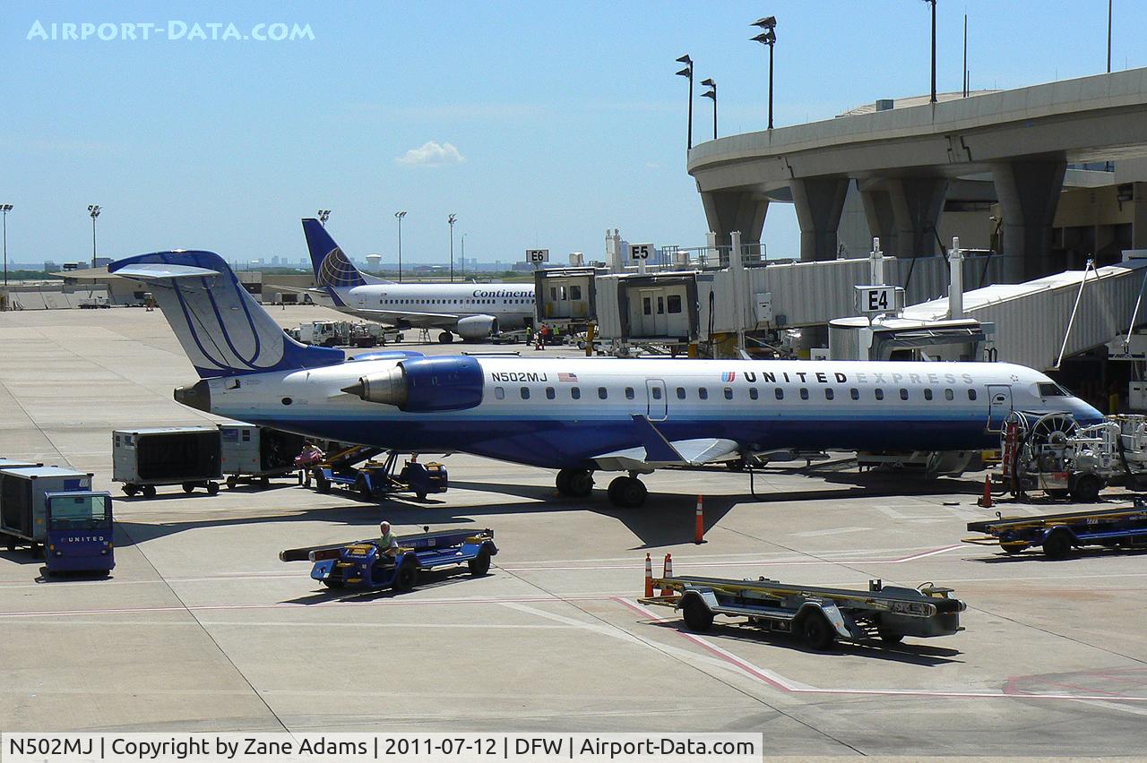 N502MJ, 2002 Bombardier CRJ-700 (CL-600-2C10) Regional Jet C/N 10050, United Express at the gate - DFW Airport