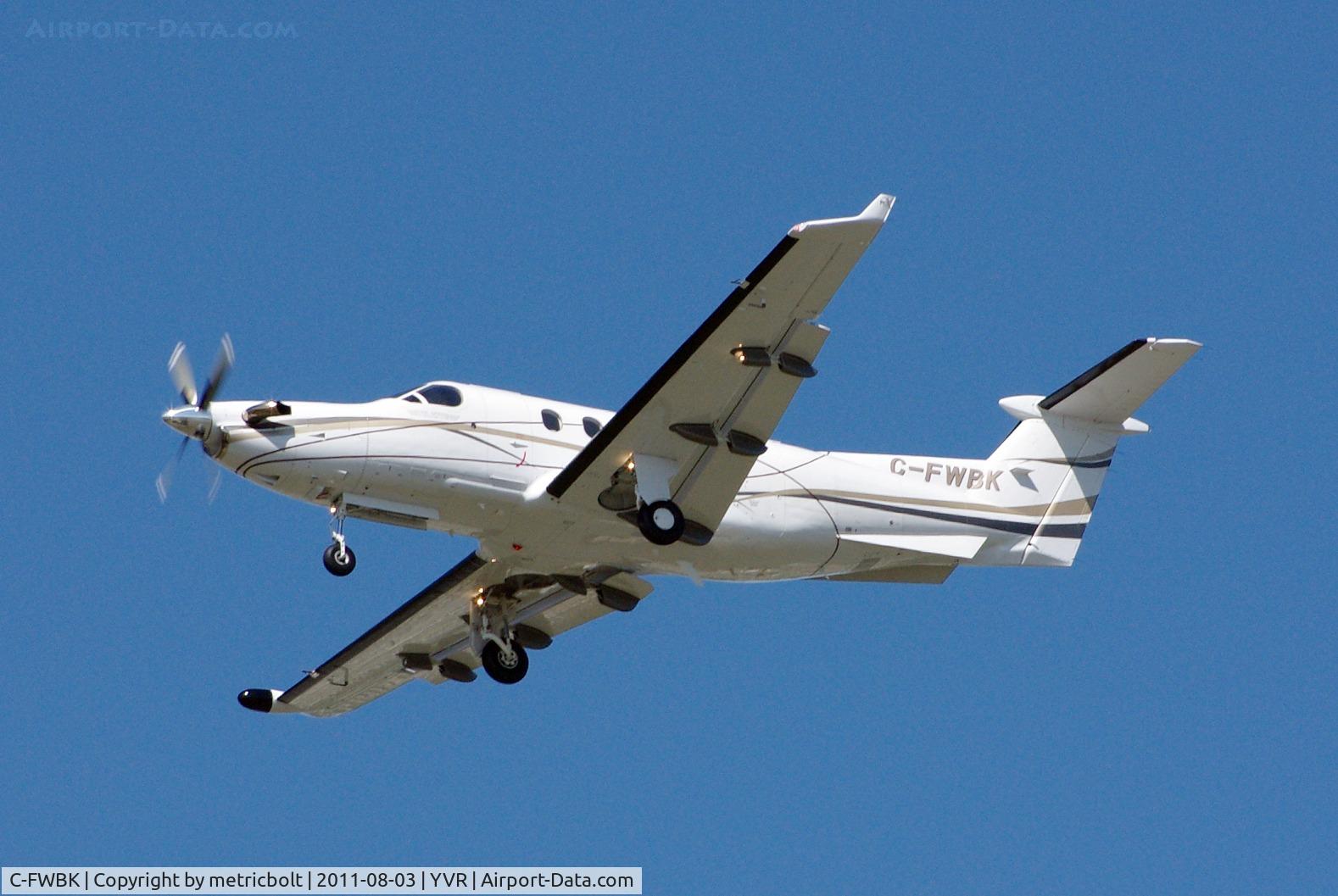 C-FWBK, 2003 Pilatus PC-12/45 C/N 503, Landing on a bright, sunny day .