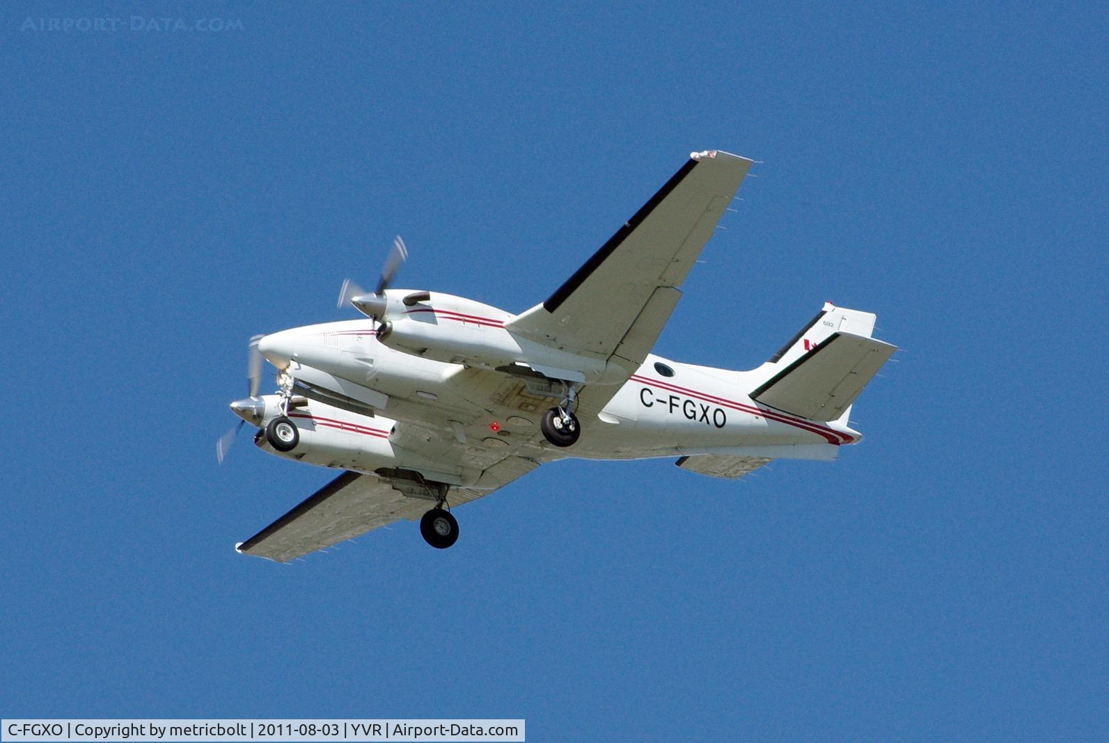 C-FGXO, 1989 Beech C90A King Air C/N LJ-1200, Landing on a bright, sunny day .