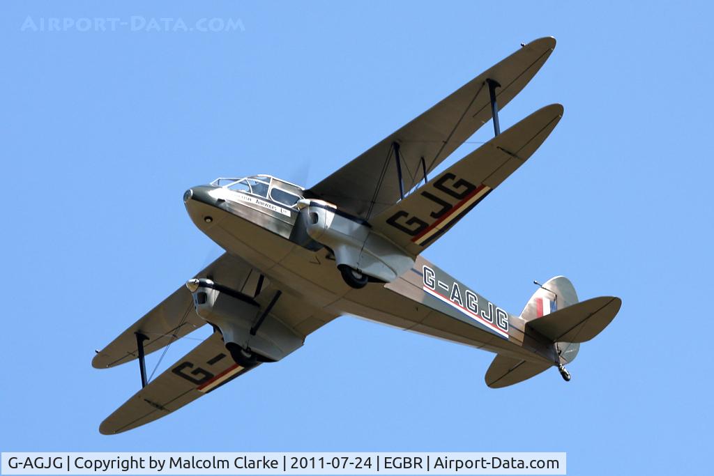 G-AGJG, 1941 De Havilland DH-89A Dominie/Dragon Rapide C/N 6517, De Havilland DH89A Dragon Rapide performs a fly-by on leaving Breighton Airfield's Wings & Wheels Weekend, July 2011.
