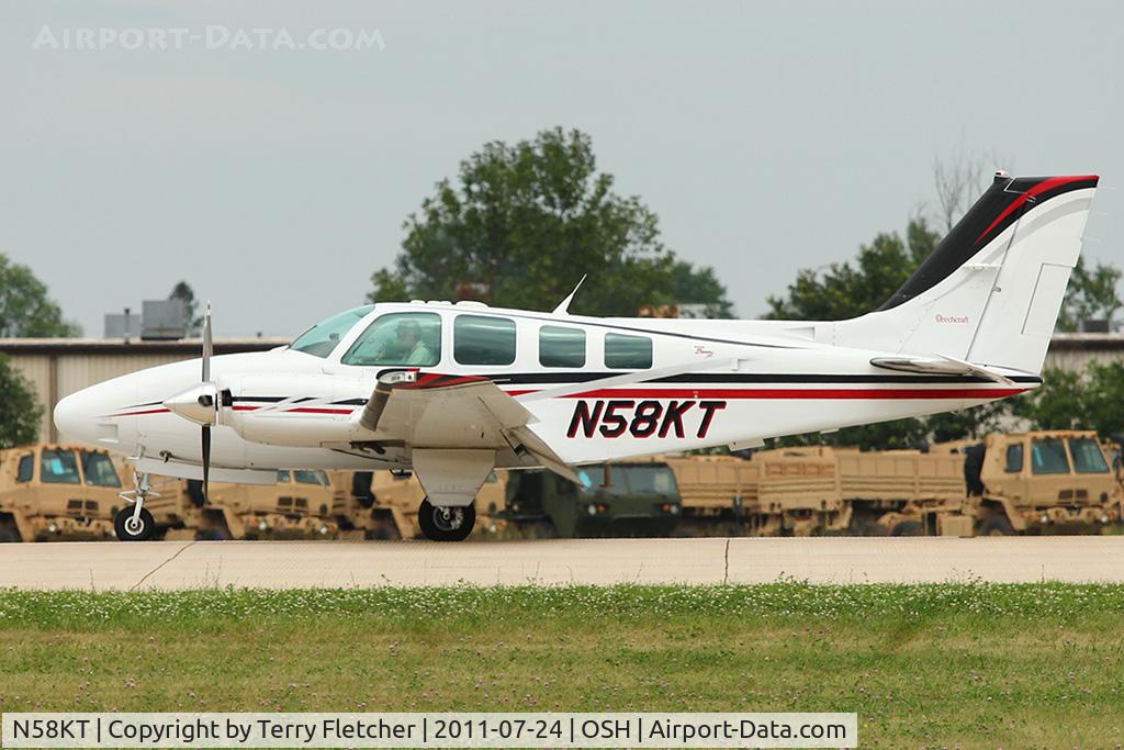 N58KT, 2000 Raytheon Aircraft Company 58 C/N TH-1955, 2000 Raytheon Aircraft Company 58, c/n: TH-1955 arriving at 2011 Oshkosh