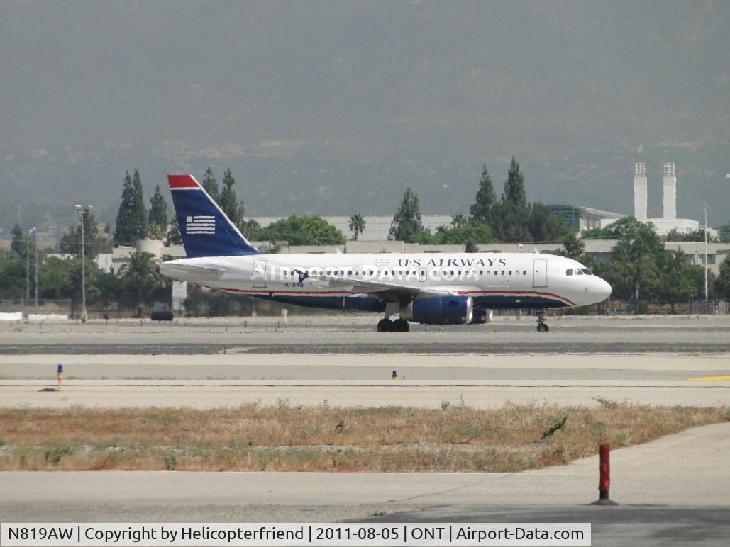 N819AW, 2000 Airbus A319-132 C/N 1395, Just landed on runway 26R and in the process of taxiing to terminal