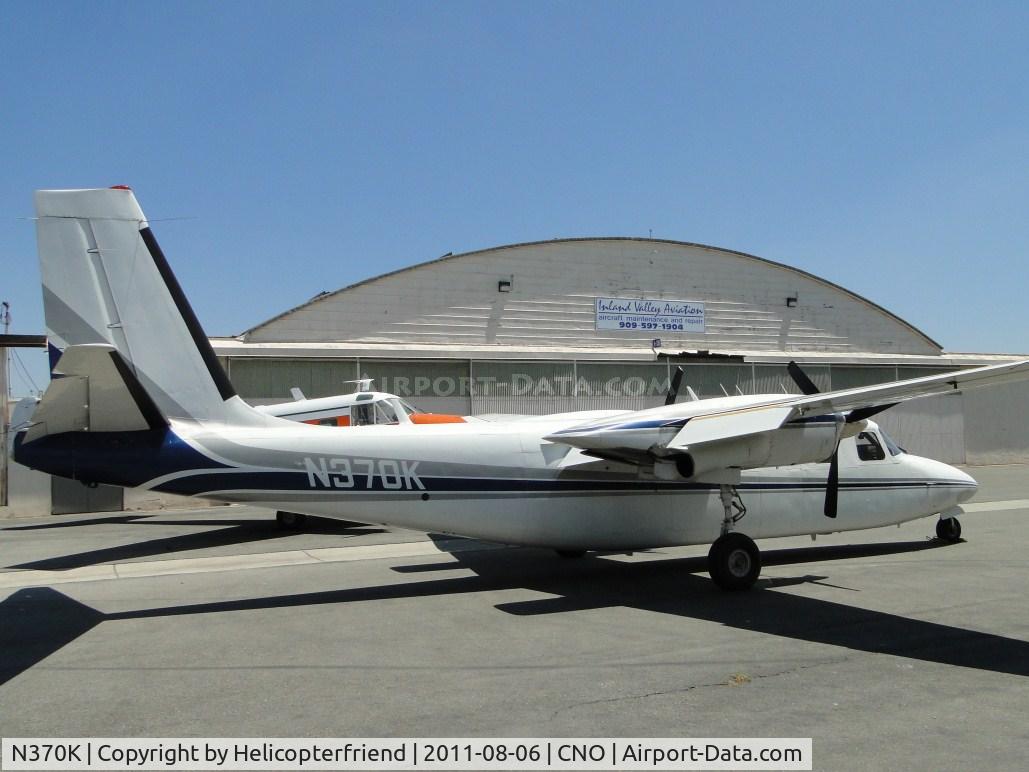 N370K, 1966 Aero Commander 680V Turbo Commander C/N 1570-25, Parked near a hanger