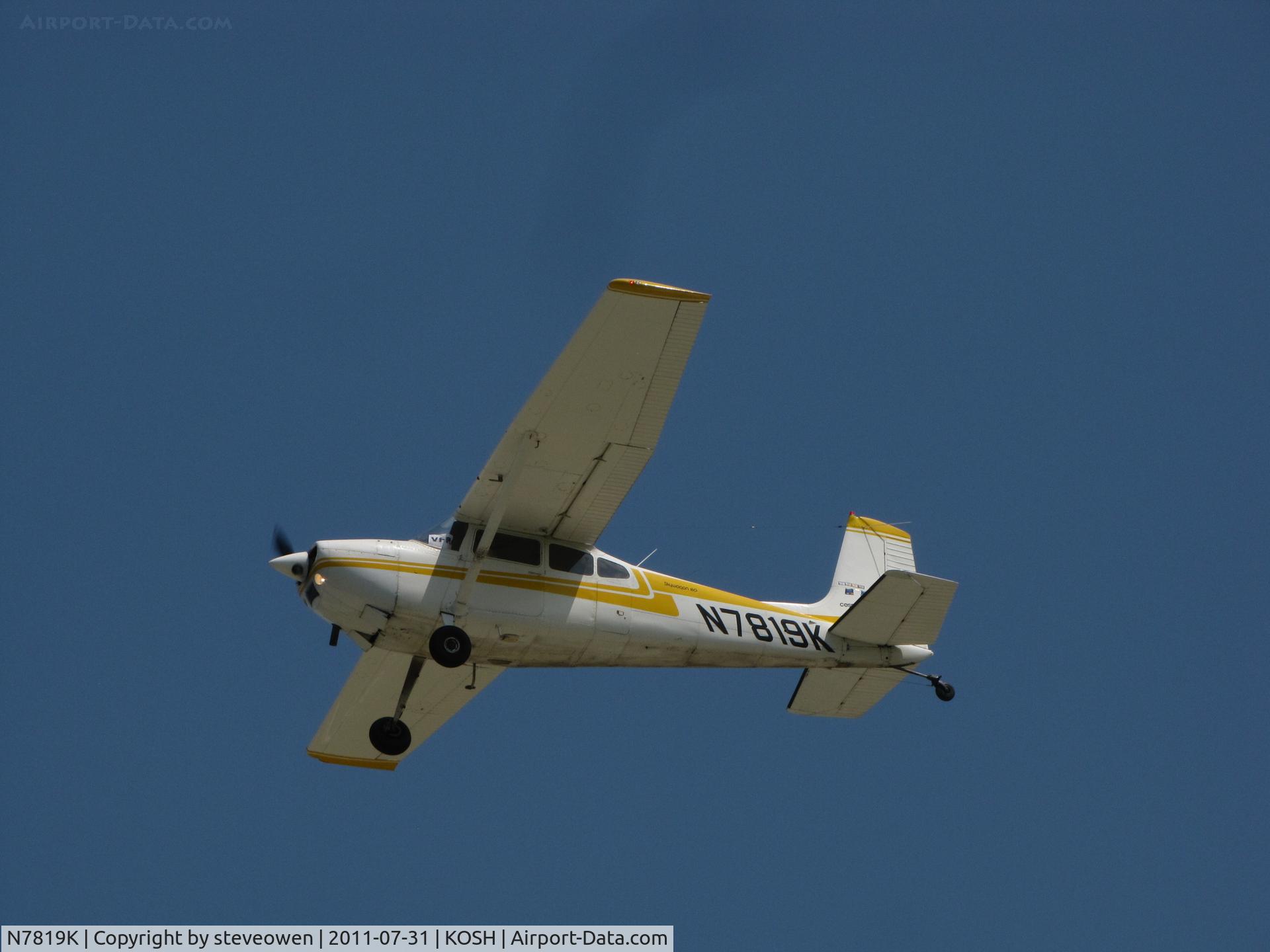 N7819K, 1976 Cessna 180J C/N 18052753, leaving Oshkosh EAA 2011