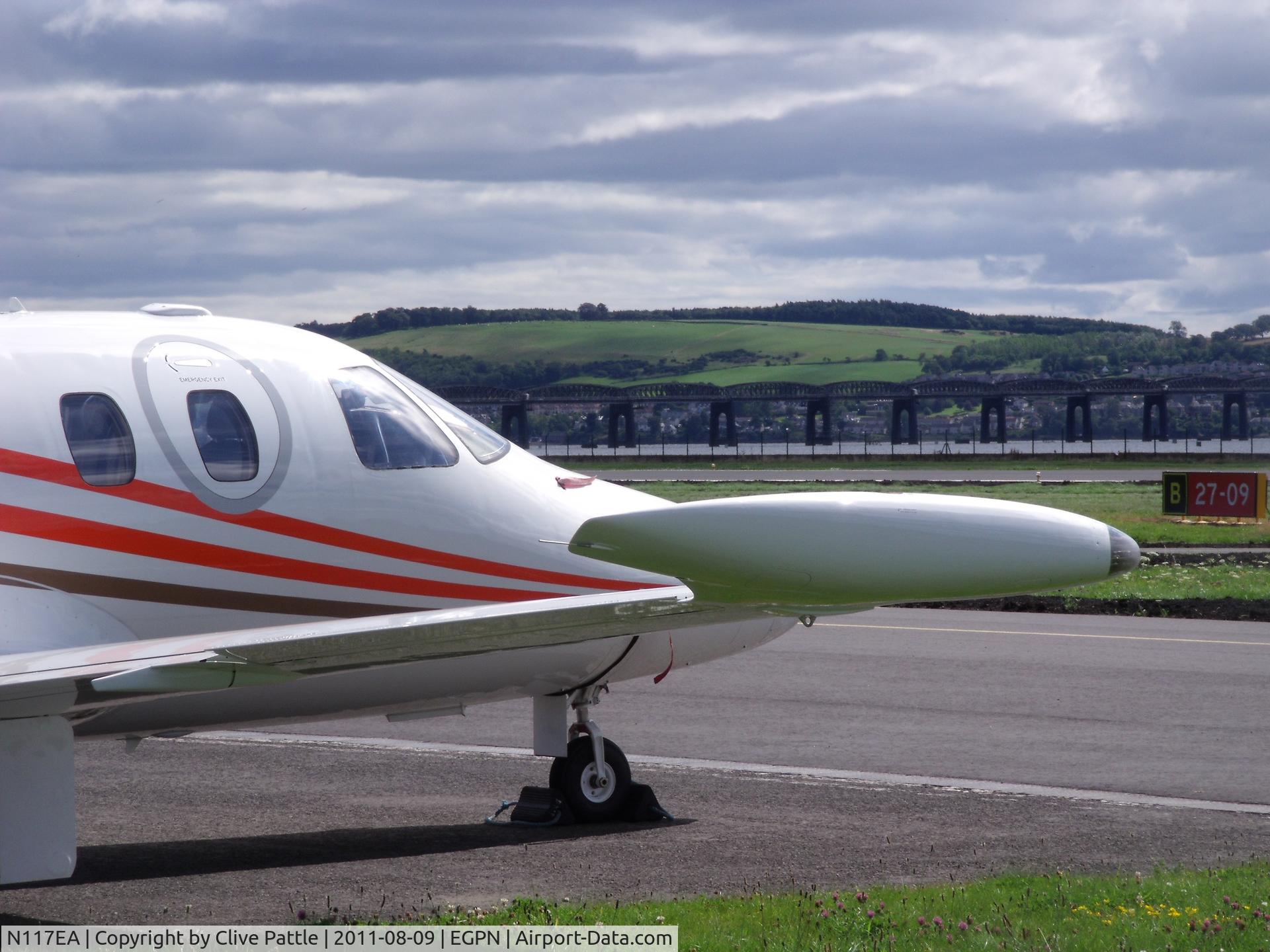 N117EA, 2007 Eclipse Aviation Corp EA500 C/N 000104, At Dundee Riverside (EGPN). The Tay Rail Bridge in the background